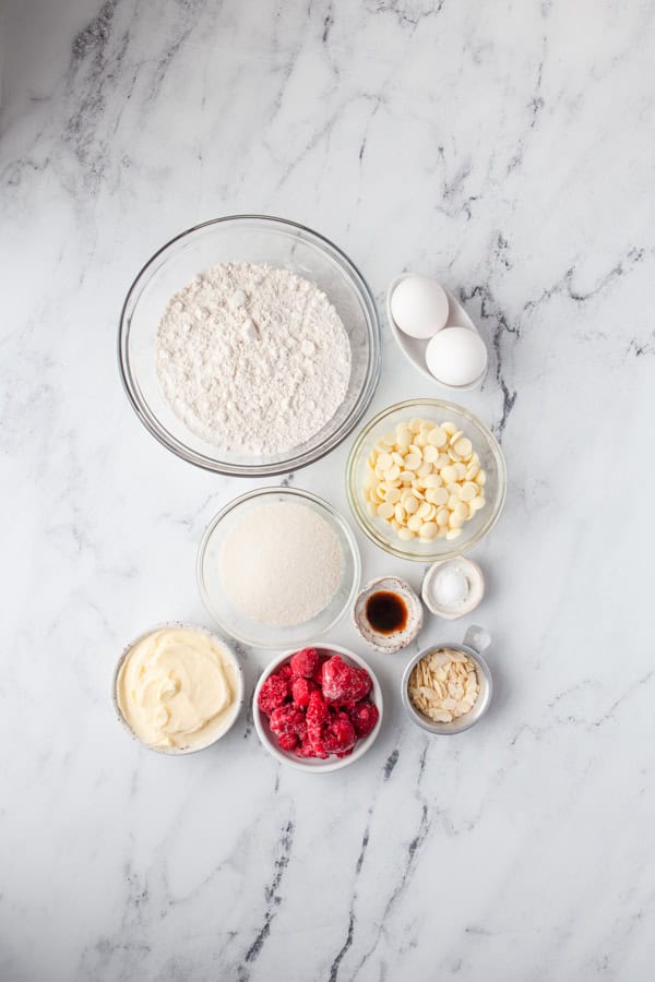 Ingredients to make White chocolate berry blondies on a table.