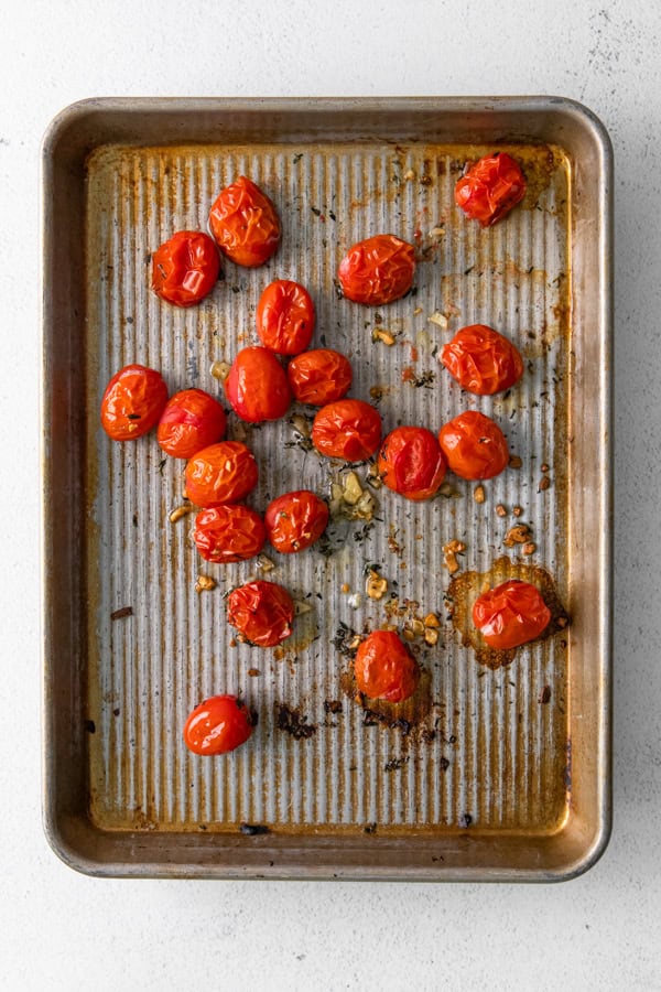 Roasted tomatoes on a sheet pan. 