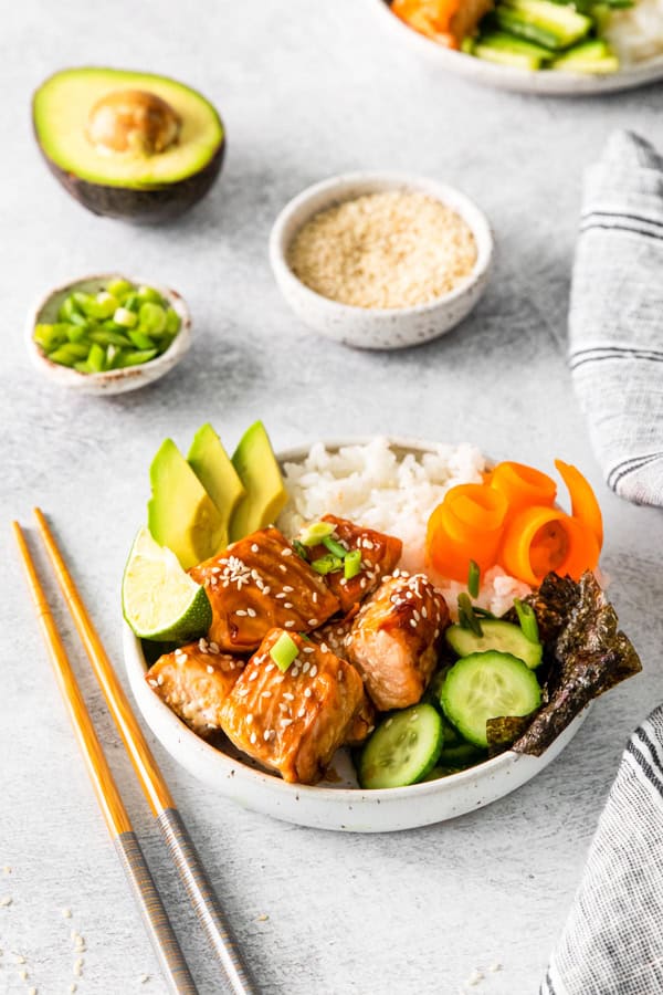 Teriyaki Salmon Bowl topped with green onions.
