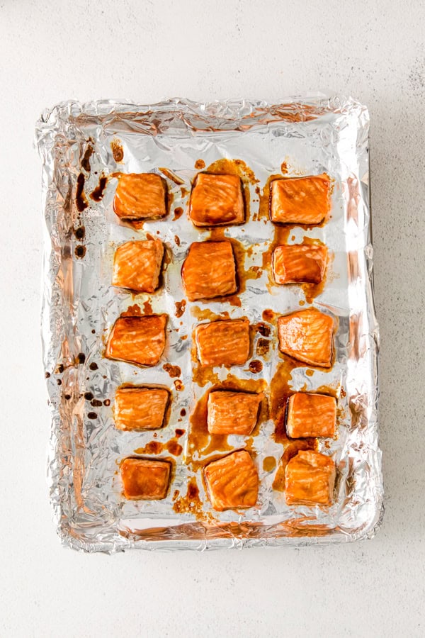 Baked teriyaki salmon on a sheet pan.