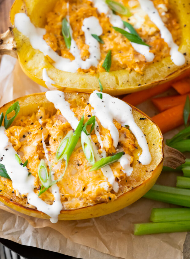 Buffalo Chicken Stuffed Spaghetti Squash on parchment paper. 