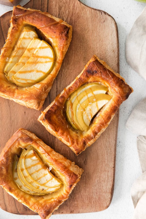 Caramel Apple Danish served on a wooden tray.