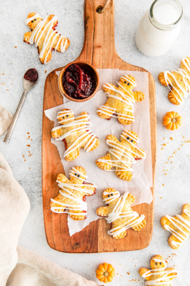 Mummy Hand Pies on a wooden board. 