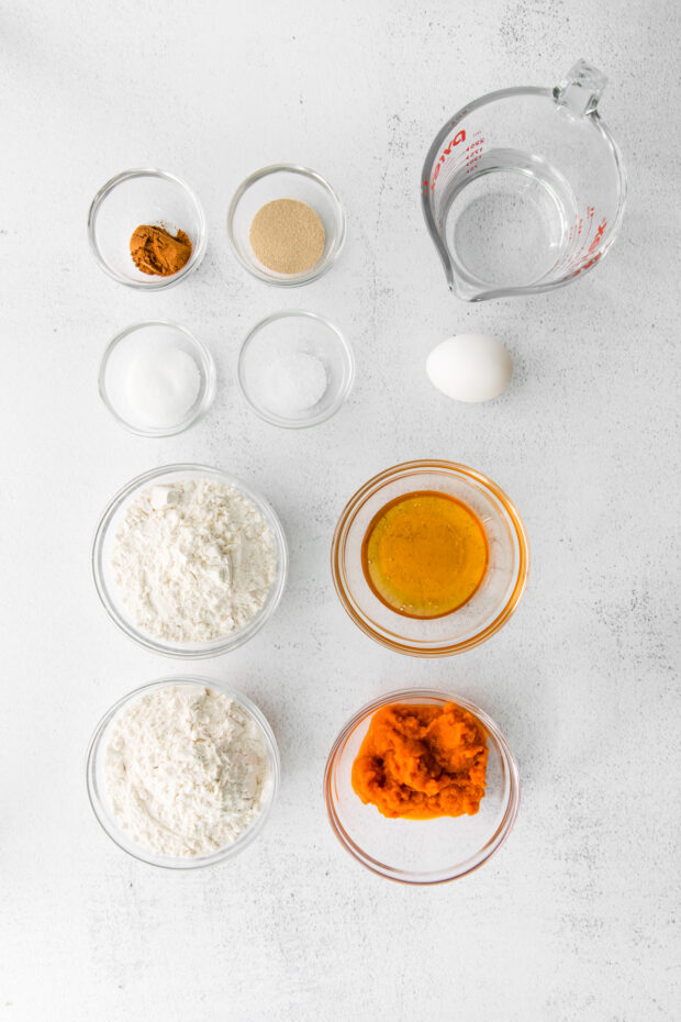 Ingredients to make Homemade Pumpkin Bagels on a table.