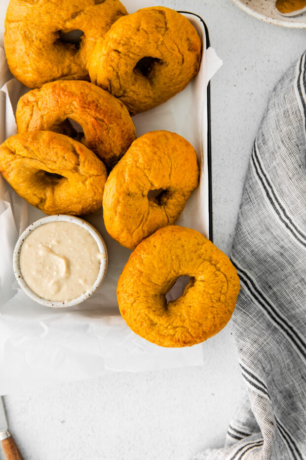 Homemade Pumpkin Bagels with cream cheese.