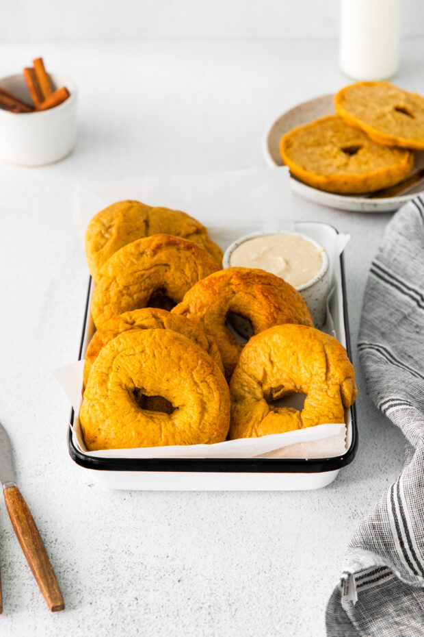 Homemade Pumpkin Bagels in a storage tin.