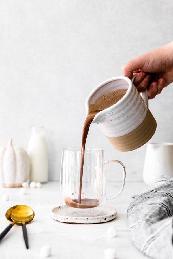 Pumpkin Spice Hot Chocolate getting poured into a mug.