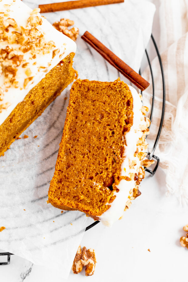 The Best Pumpkin Bread covered in cream cheese frosting.