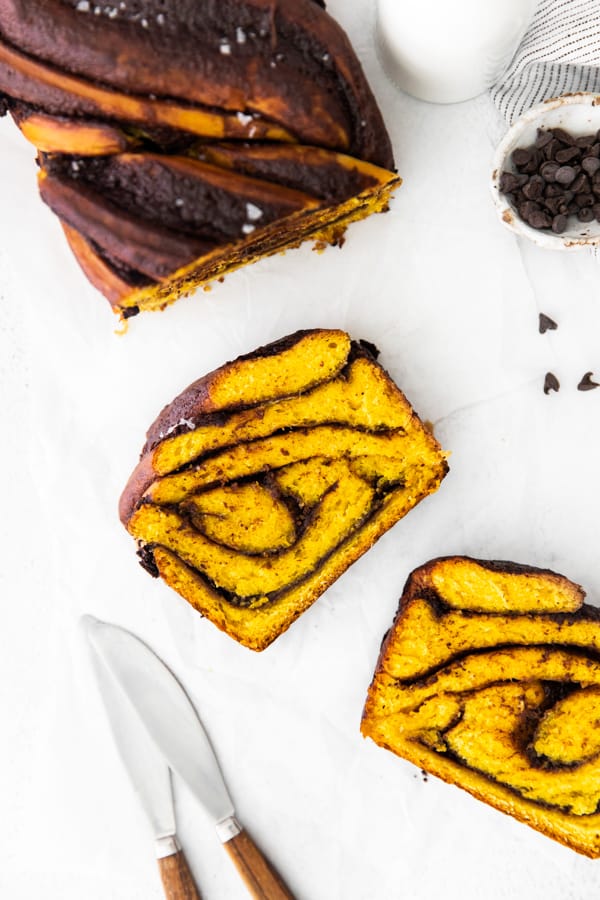 Pumpkin Chocolate Babka sliced on a cutting board. 