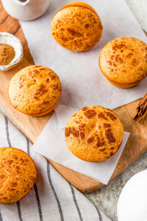 Sweet Pumpkin Cornbread Muffins topped with cinnamon. 