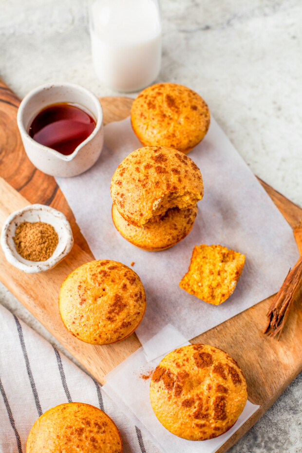 Sweet Pumpkin Cornbread Muffins on a wooden board. 