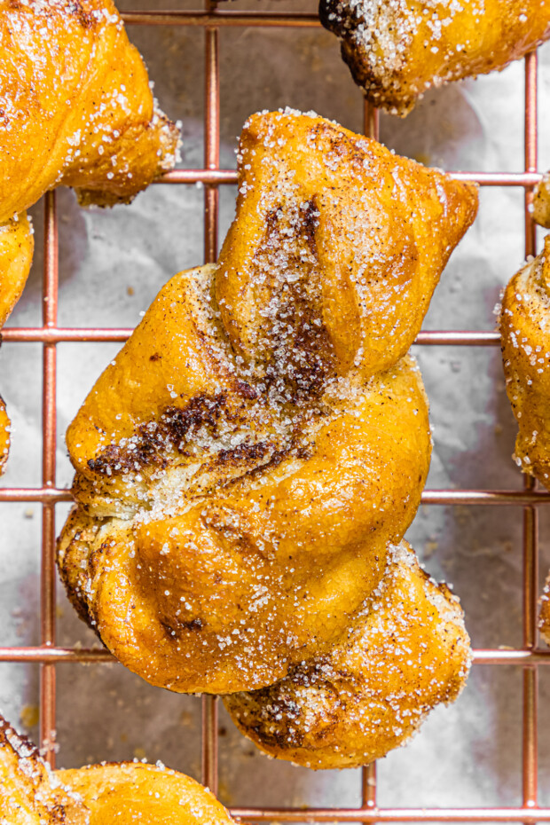 Air Fryer Cinnamon Sugar Knot sitting on a wire rack. 