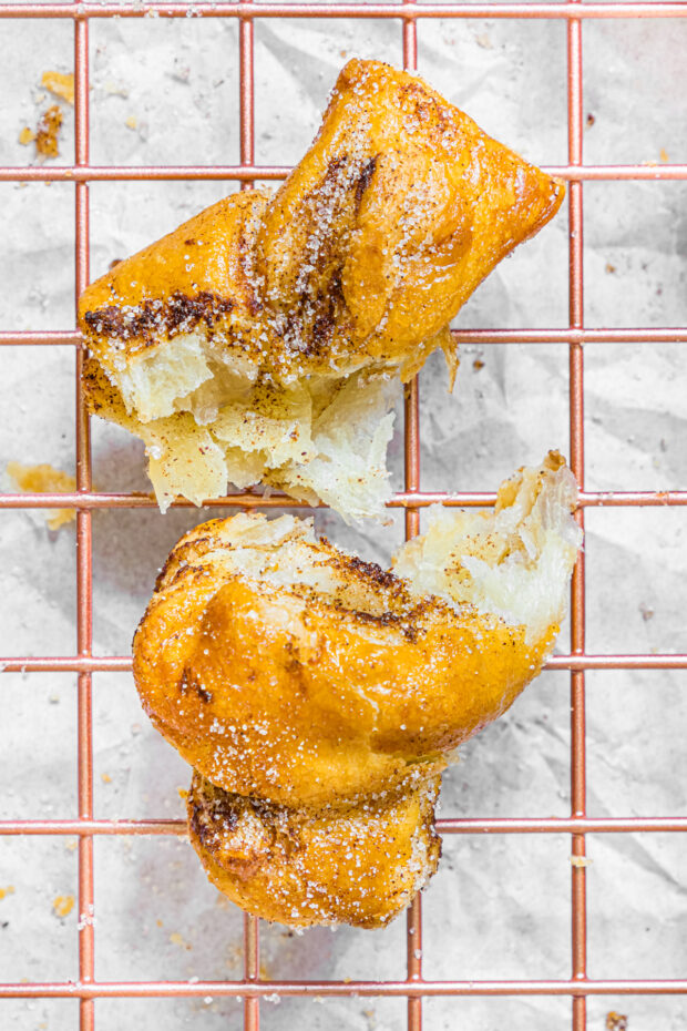 Air Fryer Cinnamon Sugar Knot pulled apart to show the cinnamon center. 