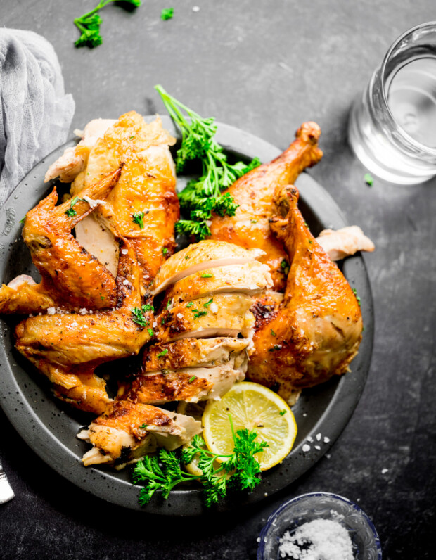 Air Fryer Whole Chicken sliced on a plate.