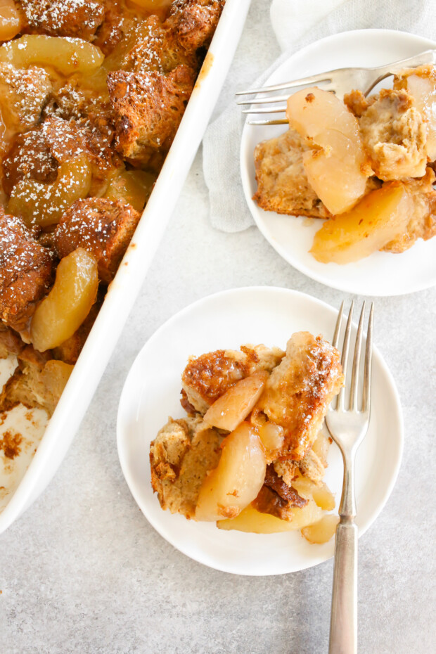 Apple Pie Baked French Toast sitting on 2 small white plates. 