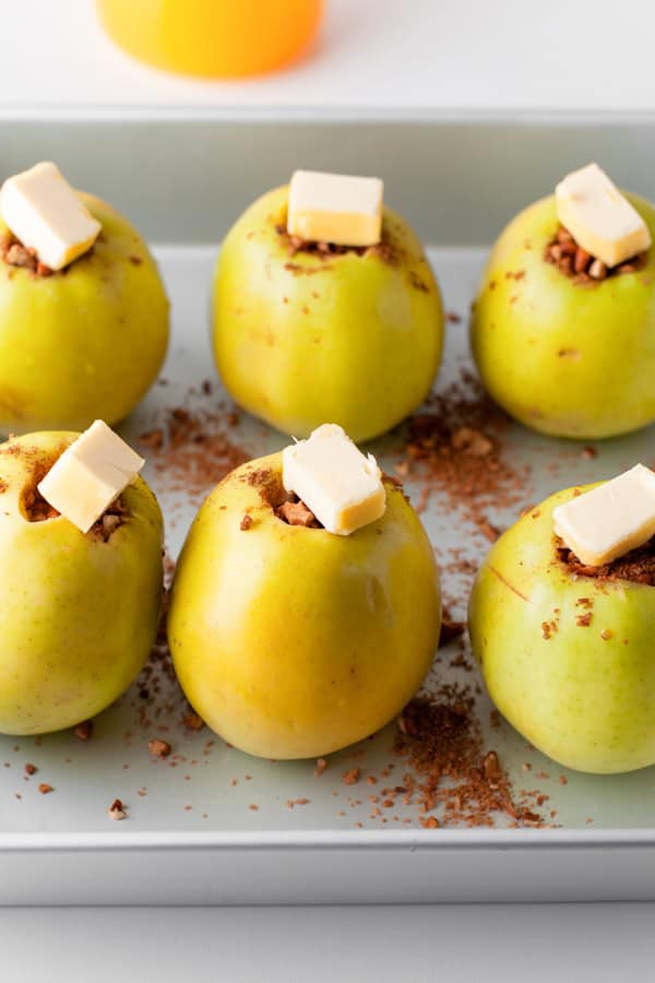 Cinnamon Baked Apples in a pan covered with butter. 