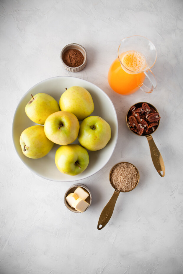 Cinnamon Baked Apples ingredients on a table. 