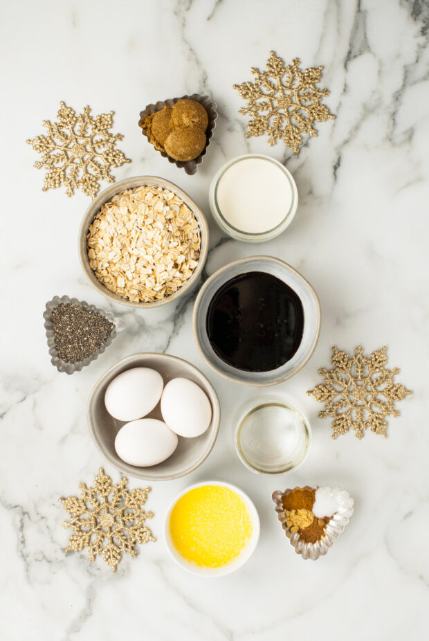 Baked Gingerbread Oatmeal ingredients sitting on a marble table. 