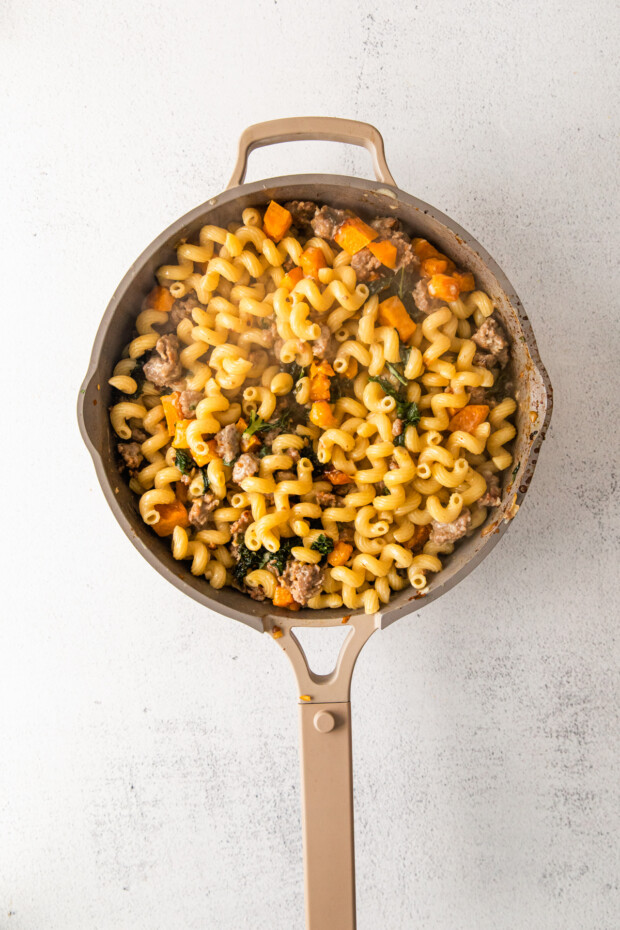 Butternut Squash Sausage Pasta in a skillet. 