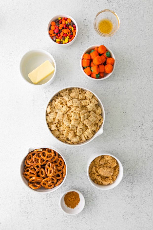 Ingredients to make Harvest Chex Mix on a table. 
