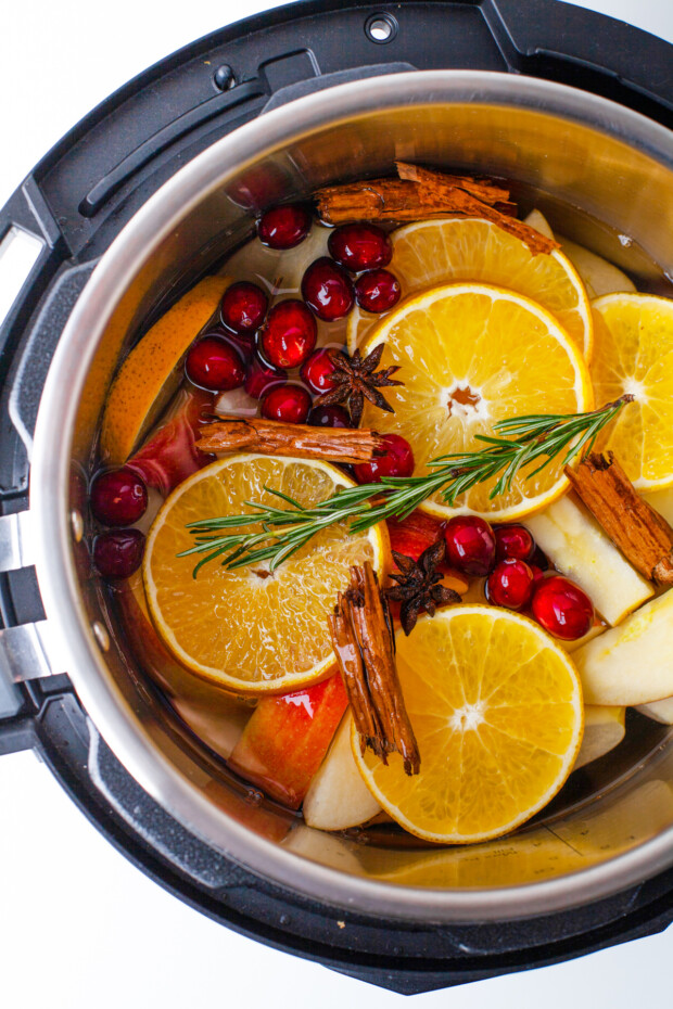 Ingredients inside an instant pot for homemade apple cider. 