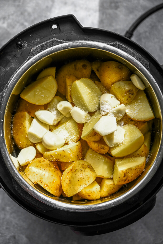 Chopped potatoes and garlic in the Instant Pot.