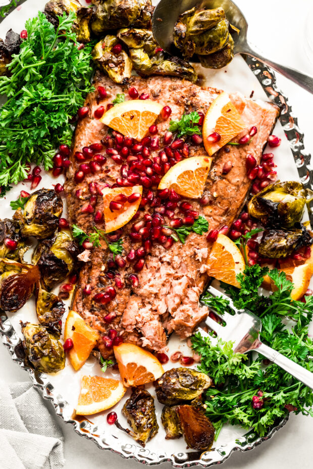Marinated Sheet Pan Salmon on a plate with a serving fork. 