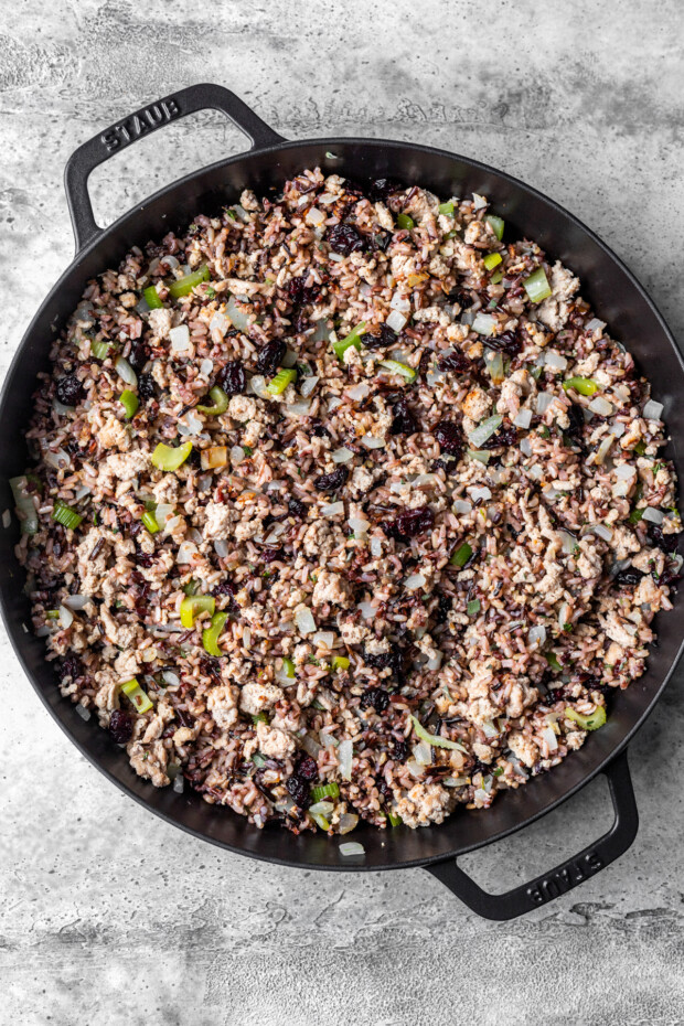 Ground turkey and rice cooked in a skillet. 