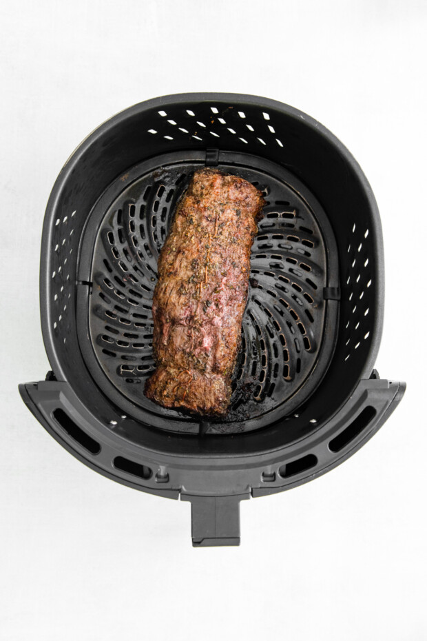 Air Fryer Beef Tenderloin cooked in the air fryer basket. 