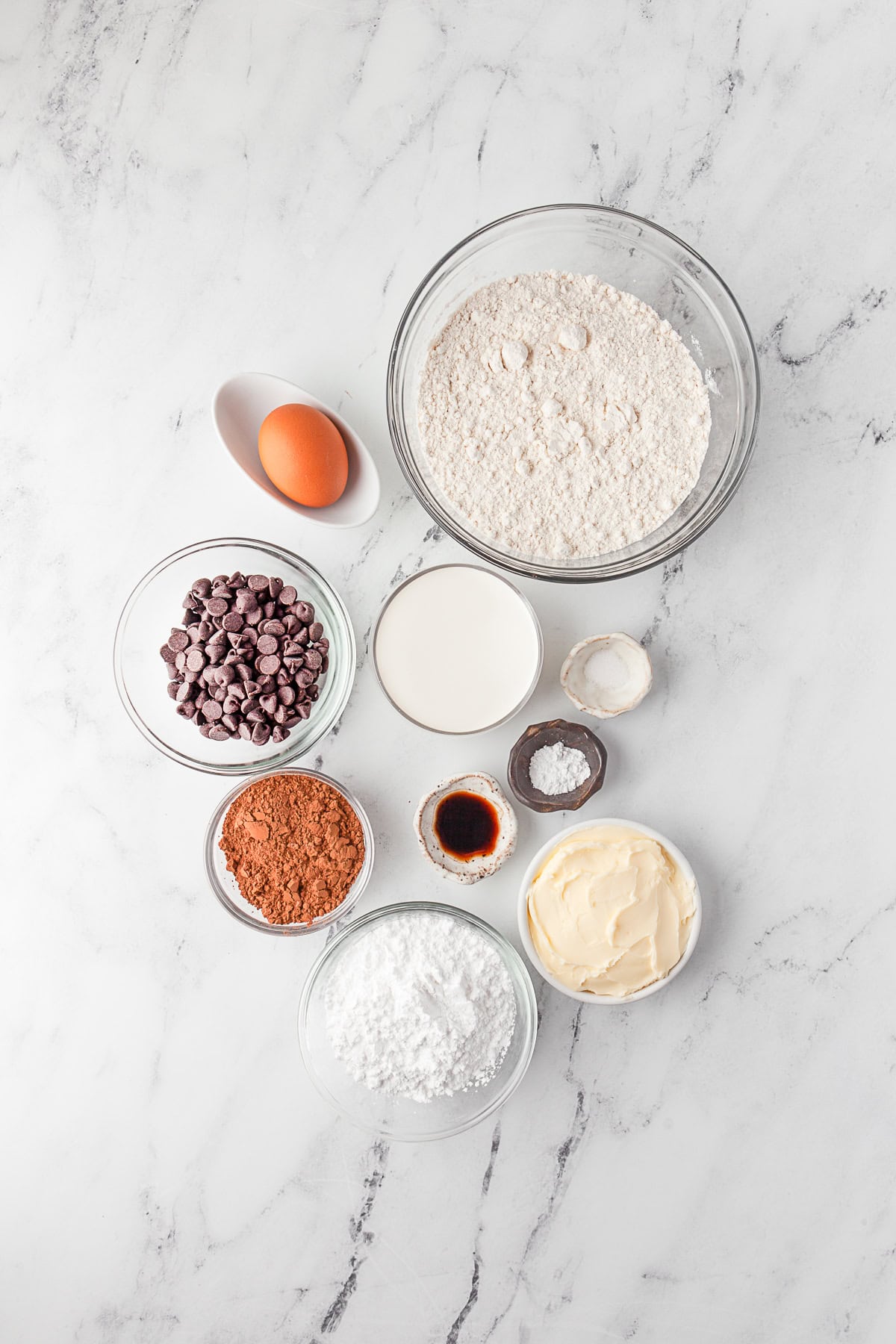 Ingredients to make Double Chocolate Thumbprint Cookies on a table.
