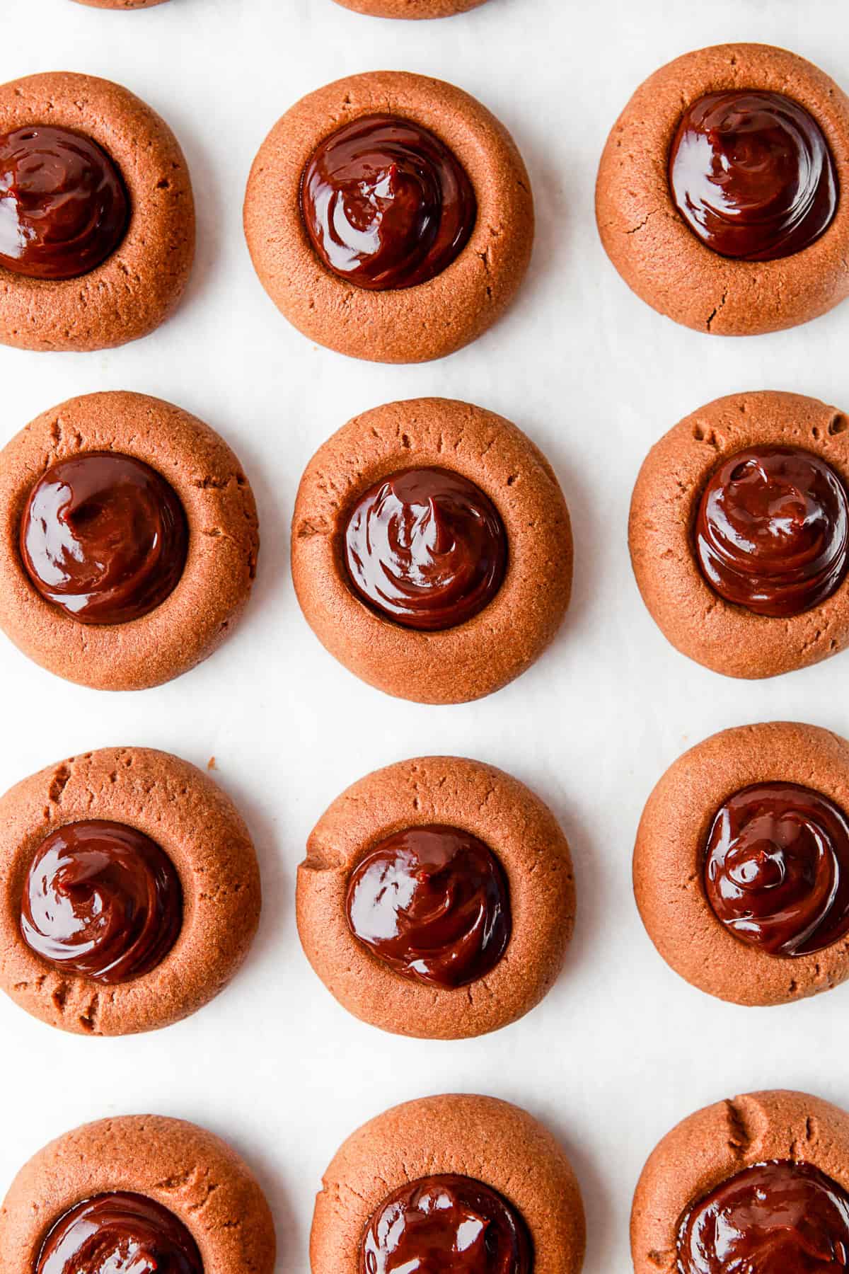 Double Chocolate Thumbprint Cookies sitting in a row.