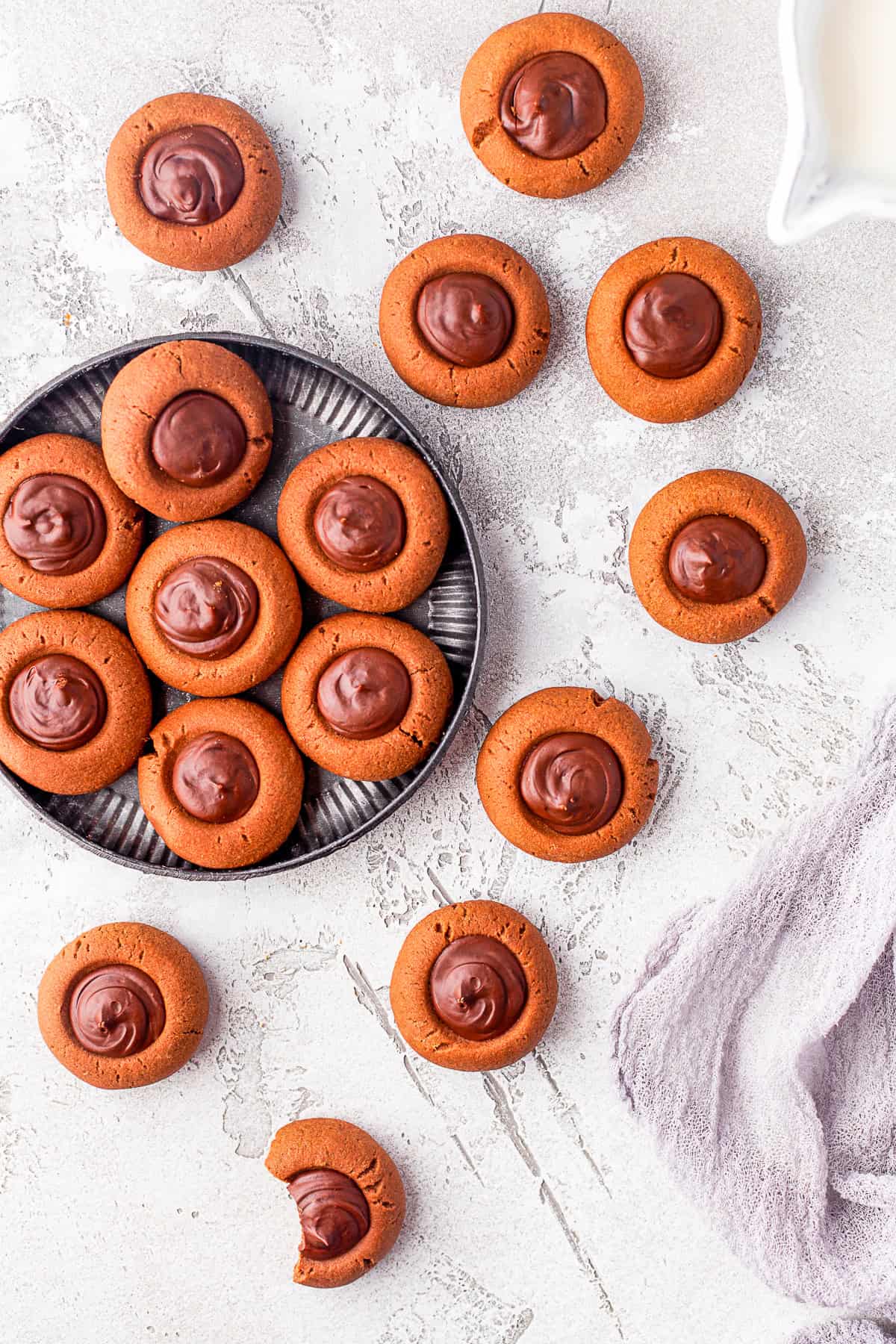 Double Chocolate Thumbprint Cookies on a plate sitting on a table.