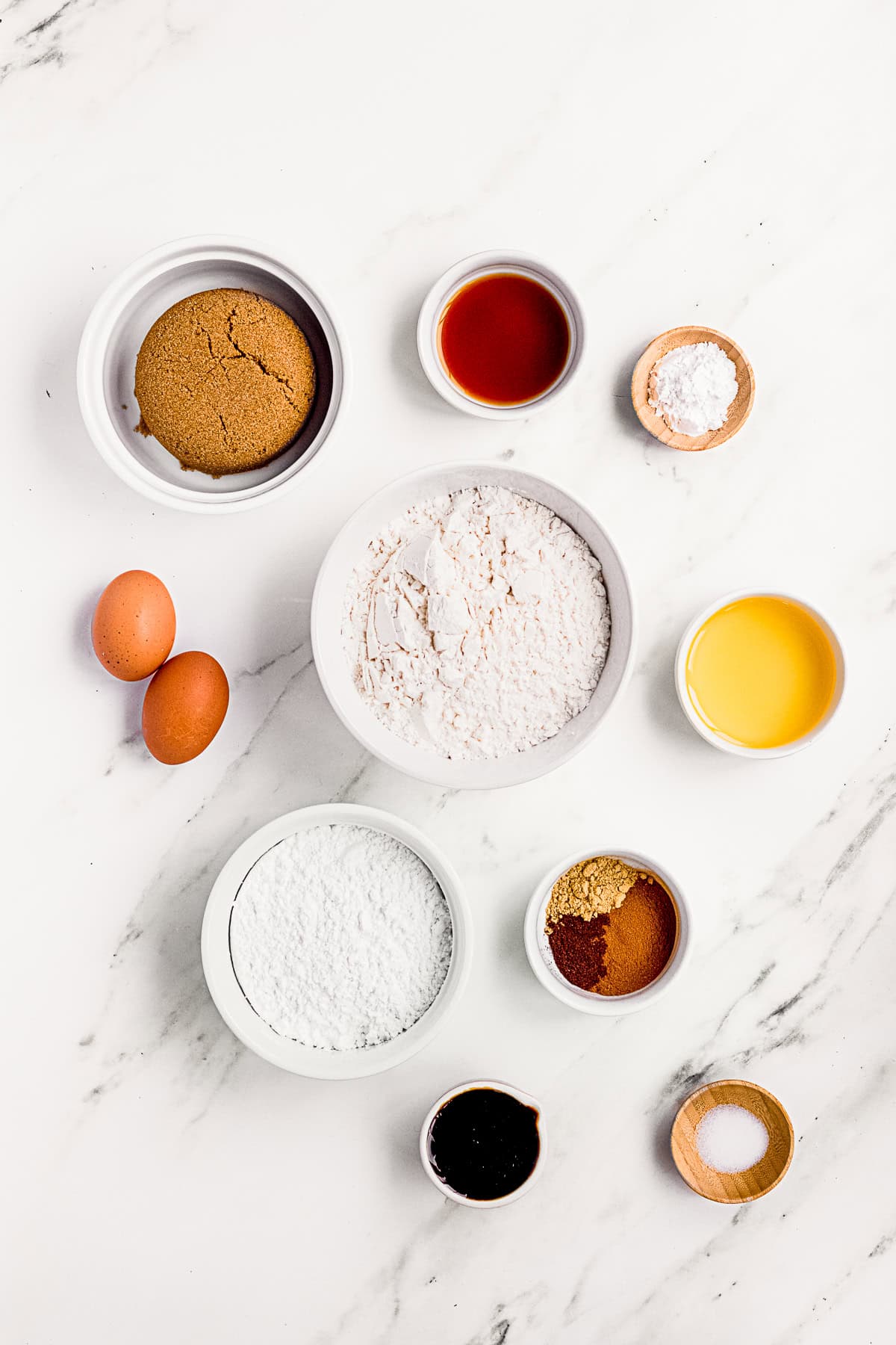 Ingredients to make Molasses Crinkle Cookies on a table.
