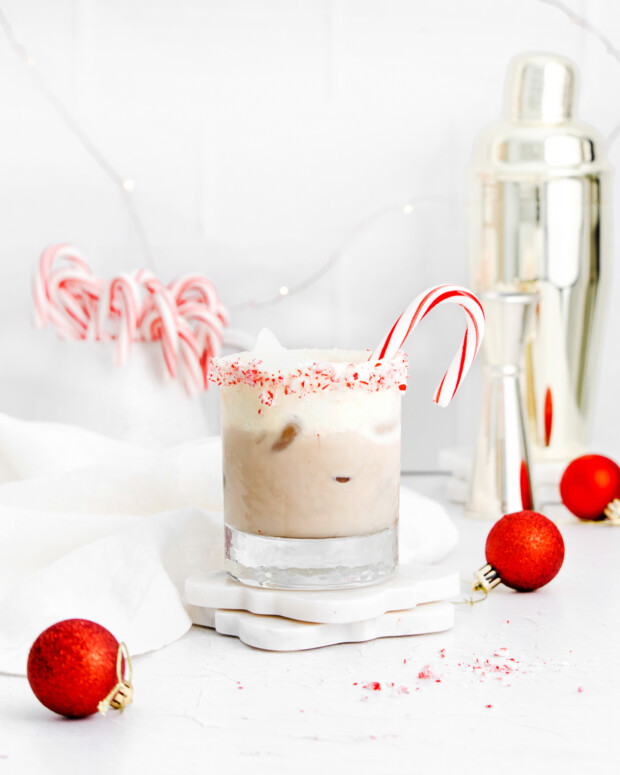 Peppermint White Russian sitting on  a coaster. 