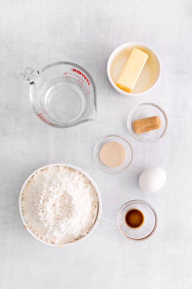 Ingredients to make Spiced Orange Cinnamon Rolls on a table.