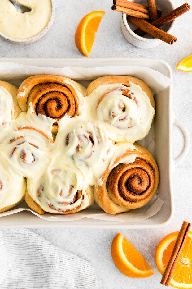 Spiced Orange Cinnamon Rolls topped with orange frosting.