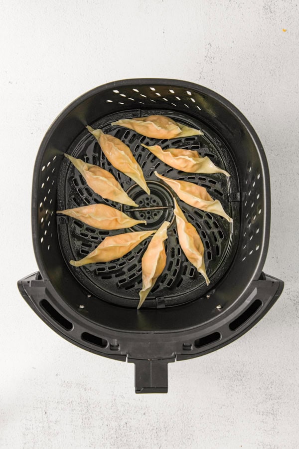 Air Fryer Buffalo Chicken Wontons uncooked in an air fryer. 
