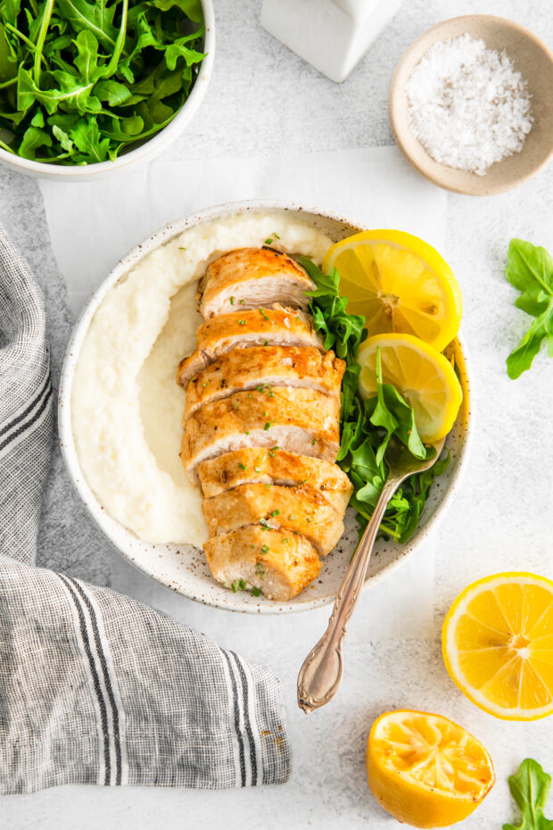 Air Fryer Lemon Chicken served with salad and mashed potatoes. 