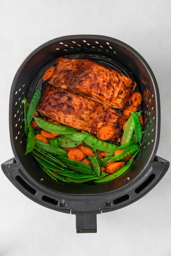 Cooked Air Fryer Miso Salmon in the air fryer basket. 