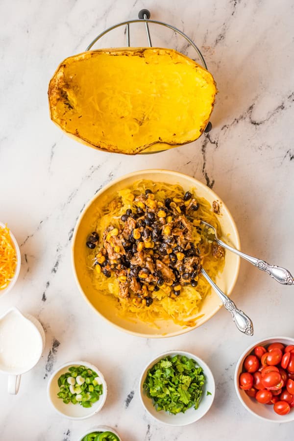 Shredded spaghetti squash mixed with cooked meat and beans. 