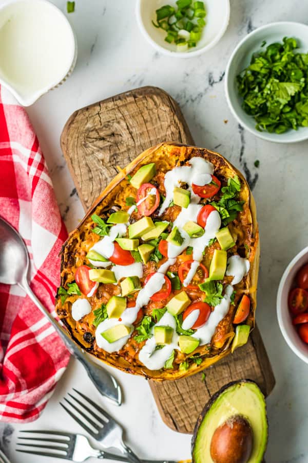 Air Fryer Southwest Spaghetti Squash topped with avocado, cilantro, and sour cream. 