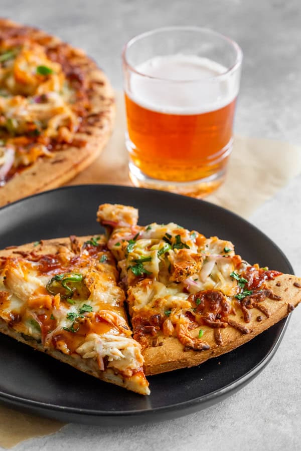 BBQ Chicken Pizza served with beer. 