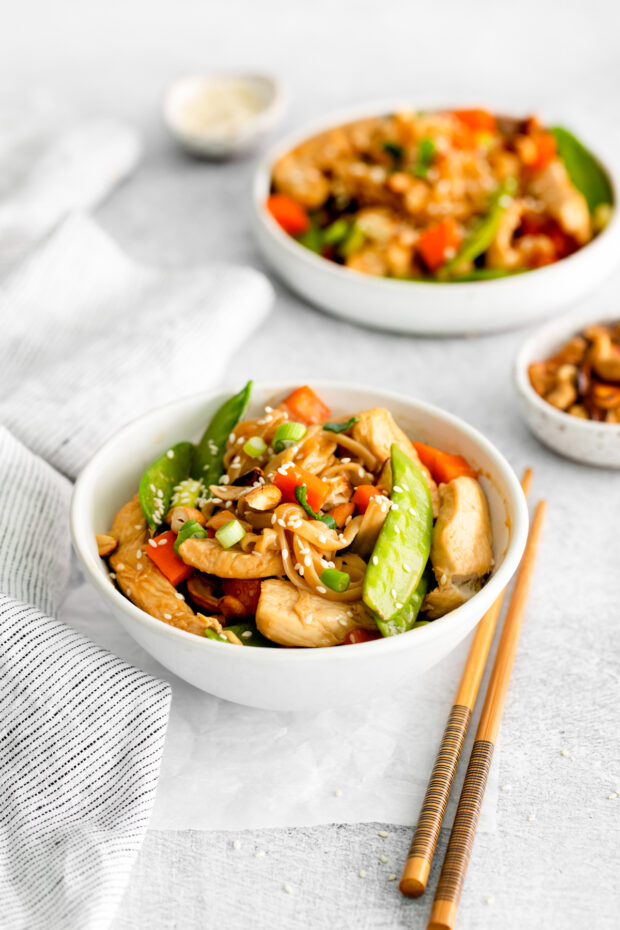 Cashew Chicken Pad Thai sprinkled with sesame seeds. 