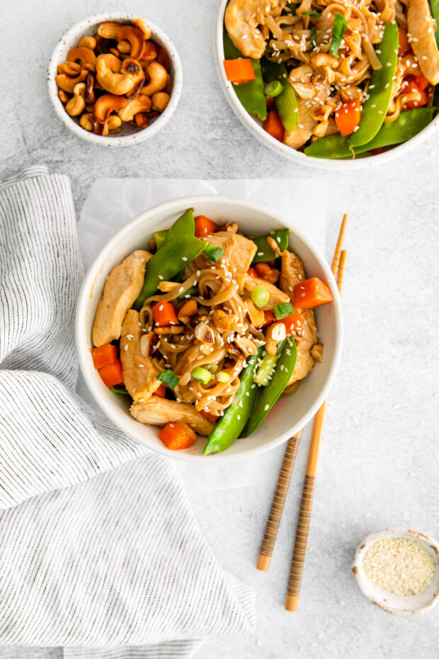Cashew Chicken Pad Thai in a bowl with chopsticks. 