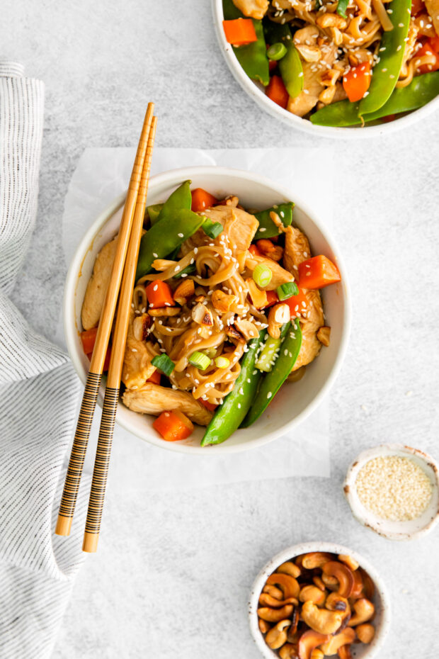 Cashew Chicken Pad Thai in a bowl with chopsticks. 