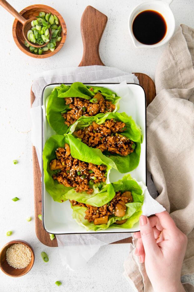 P.F. Chang's Chicken Lettuce Wraps in a dish with sesame seeds for topping.