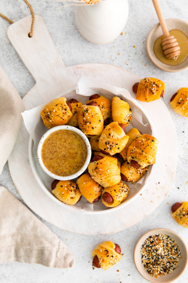 Everything Bagel Pigs in a Blanket in a round bowl.