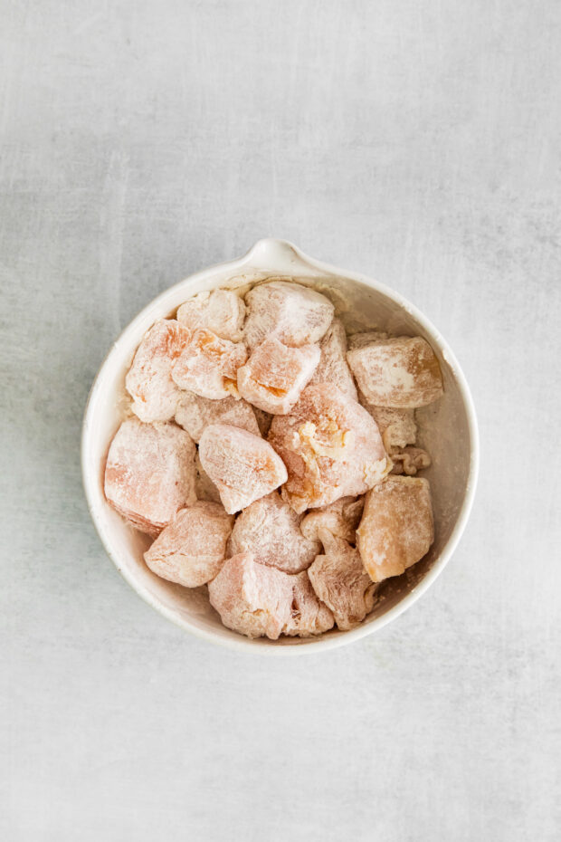 Chicken tossed in cornstarch.