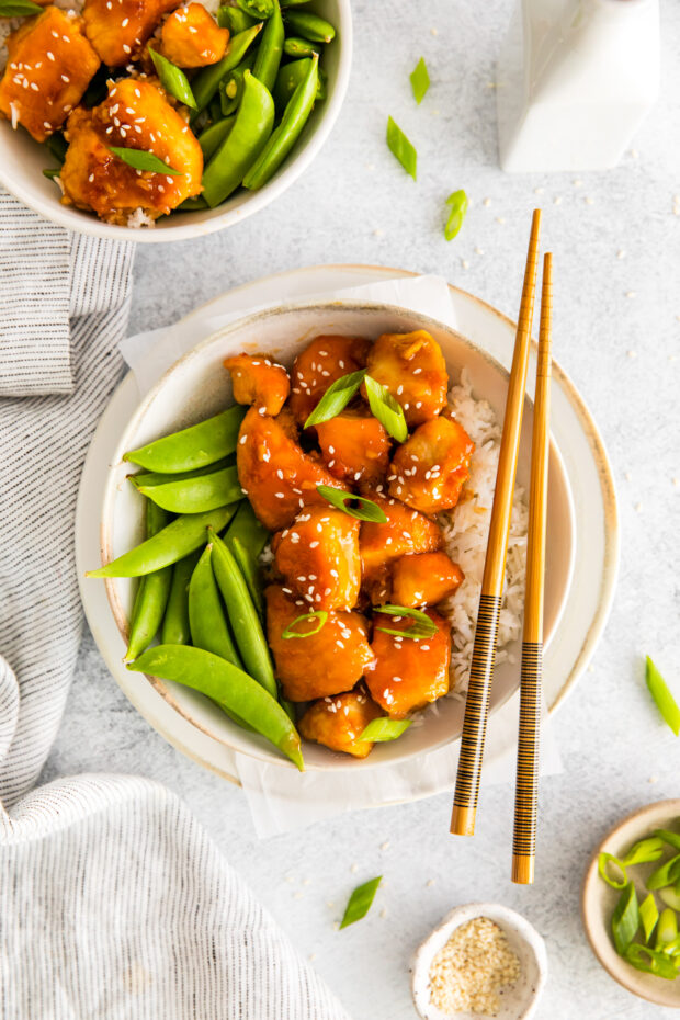 Honey Garlic Chicken Bowls in a bowl with chop sticks.