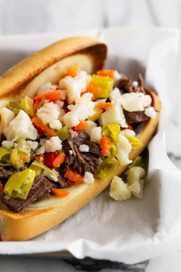 Instant Pot Italian Beef Sandwich topped with Giardiniera. 